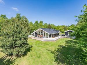 an aerial view of a house with a large yard at Holiday Home with Spa & Sauna in Oksbøl