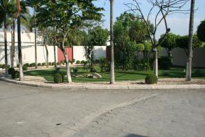 a street with trees on the side of a road at Top&acute;s Motel (Adult Only) in Jacare&iacute;