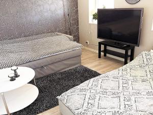Postel nebo postele na pokoji v ubytování Holiday home Höviksnäs VIII