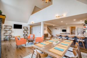 a dining room and living room with a table and chairs at Tanglewood Retreat in Post Falls