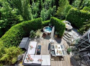 an overhead view of a deck with a pool and chairs at Luxuslodge - Zeit zum Leben in Annaberg im Lammertal +44 photos