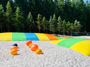 a beach with volley balls in the sand at Mumlava Resort Harrachov in Harrachov
