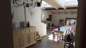 a kitchen with a table and a dining room at Di Luna e Di Sole in Sarzana