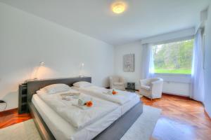 Postel nebo postele na pokoji v ubytování Residenza Parco Carona - Happy Rentals