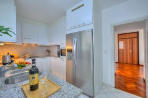 Kuchyň nebo kuchyňský kout v ubytování Residenza Parco Carona - Happy Rentals