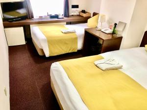 Vuode tai vuoteita majoituspaikassa Pod Select Hotel Shinjuku