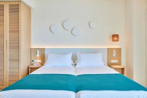 Кровать или кровати в номере Universal Hotel Aquamarin