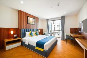 Postel nebo postele na pokoji v ubytování PLUS VUNG TAU HOTEL