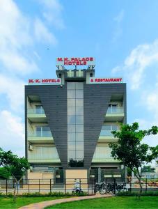 a building with a sign on top of it at M K HOTEL AND RESTAURANT in Greater Noida