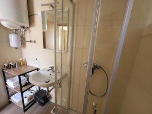 a bathroom with a shower and a sink at Holiday Home Belka with Terrace&BBQ in Tolmin +47 photos