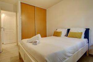 Katil atau katil-katil dalam bilik di T3 Le Frangipanier - Terrasse Jardin & Jacuzzi