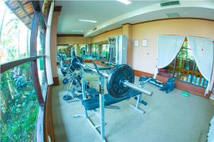 a fitness room with a gym with a treadmill at Golden Pine Resort and Spa in Ban Du