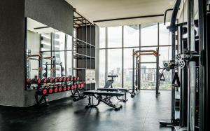 a gym with a view of a city from a window at Platz @ KL North Setapak by Airhost in Kuala Lumpur