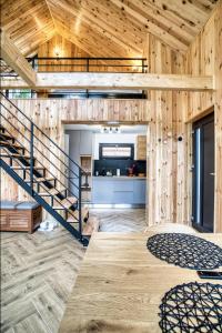 a wooden house with a staircase in a room at Norway Cabins - Private Terrace & Fire Pit in Sinaia