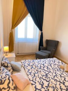 Una cama o camas en una habitación de Kerepesi City Apartment