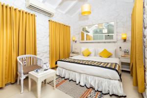 The Tamarind Hotel - A Boutique Heritage Stay, Anjuna - Goa客房内的一张或多张床位