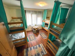 an overhead view of a room with four bunk beds at Hi Skopje Hostel in Skopje