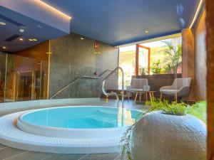 a jacuzzi tub in the middle of a house at Apartamentos Cordial Mogán Valle in Puerto de Mogán