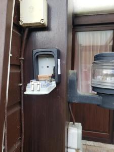 a soap dispenser on the side of a wall at Chalet 176 in Durbuy