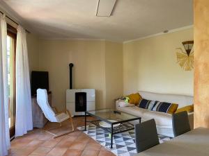 a living room with a couch and a glass table at Garda Resort Village in Peschiera del Garda