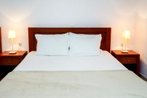 A bed or beds in a room at Kiriakos Holiday Home