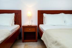 A bed or beds in a room at Kiriakos Holiday Home