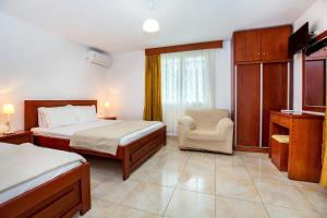 A bed or beds in a room at Kiriakos Holiday Home