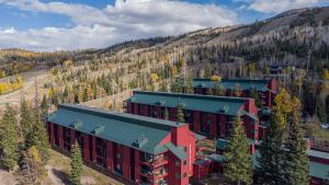 an aerial view of a building in the mountains at Giant Steps 58 Ski In-out in Brian Head