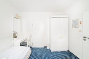 Katil atau katil-katil dalam bilik di Self-Check-In Hotel Adlon