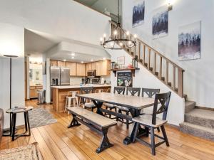 a dining room and kitchen with a table and chairs at Giant Steps 58 Ski In-out in Brian Head