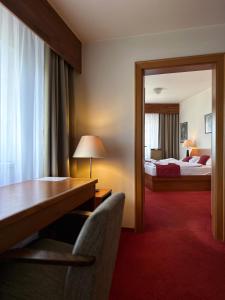 Ένα ή περισσότερα κρεβάτια σε δωμάτιο στο Hotel Theresia