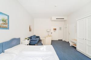 Katil atau katil-katil dalam bilik di Self-Check-In Hotel Adlon