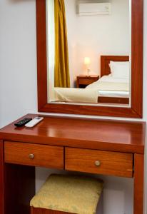 A bed or beds in a room at Kiriakos Holiday Home