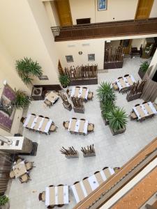 an overhead view of a restaurant with tables and chairs at Hotel Theresia in Kolín