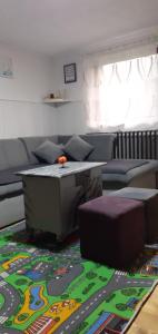 a living room with a couch and a table at Vareš in Vareš