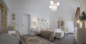 Postel nebo postele na pokoji v ubytování TAM Vacanze B&B