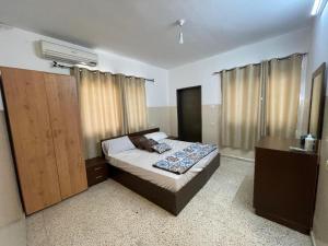 Ένα ή περισσότερα κρεβάτια σε δωμάτιο στο YCC Guesthouse