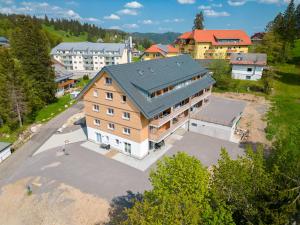 an aerial view of a large house with a green roof at Mit c in Feldberg