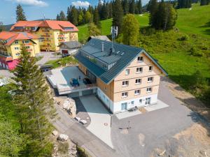 an aerial view of a large house with a roof at Mit c in Feldberg