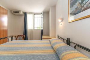 Postel nebo postele na pokoji v ubytování Hotel Villa Isola