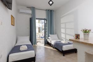 Postel nebo postele na pokoji v ubytování Kings Hersonissos Hotel