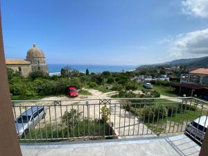 a view of the ocean from a balcony at Aether Suites Tropea - Free Parking in Tropea