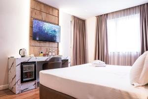Postel nebo postele na pokoji v ubytování Amfora Hotel & Spa
