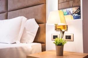 Postel nebo postele na pokoji v ubytování Amfora Hotel & Spa