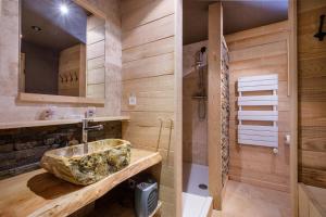 a bathroom with a stone sink and a shower at Domaine De La Plaine in Caille +22 photos