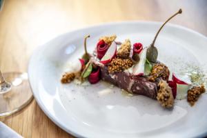 a piece of chocolate dessert on a white plate at Erfgoed Bossem in Lattrop