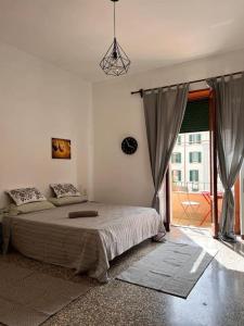 a bedroom with a bed and a large window at Big house al centro di Roma in Rome