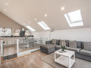 a living room with a couch and a table at Waterside Lodge Fifteen - Uk36708 in Southowram