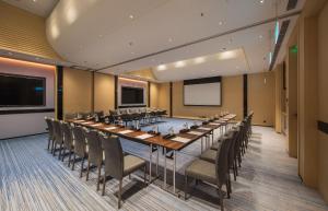 a conference room with a long table and chairs at Hong Kong Ocean Park Marriott Hotel in Hong Kong