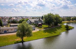 an aerial view of a town next to a river at Apartamenty nad Zalewem ARKADIA w Suwałkach in Suwałki